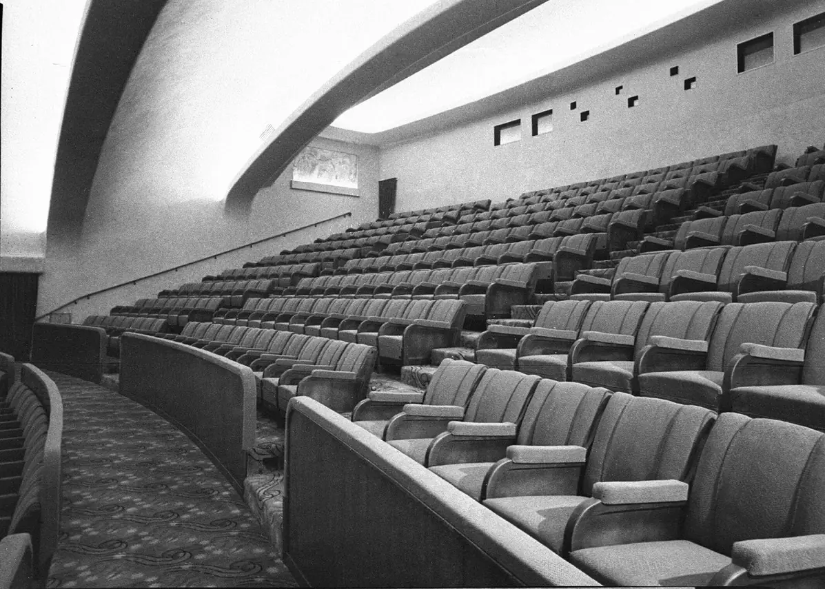 The dress circle of the Minerva auditorium in 1939, rows of seating beneath the curved ceiling